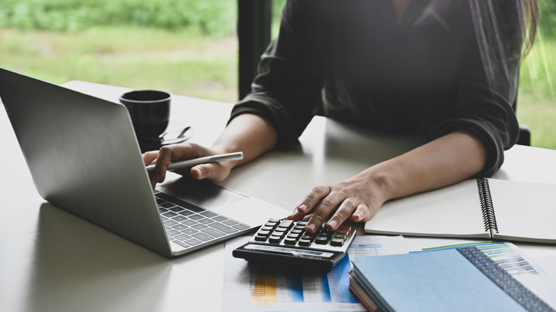 Laptop and calculator on a desk